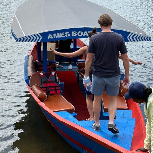 Boat tour in Kibuye or Gisenyi, clients enter boat and ready to explore lake kivu in Rwanda